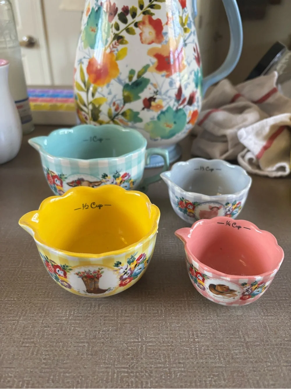 The Pioneer Woman Floral Ceramic Measuring Cups Set in Yellow, Pink, Blue, Gray